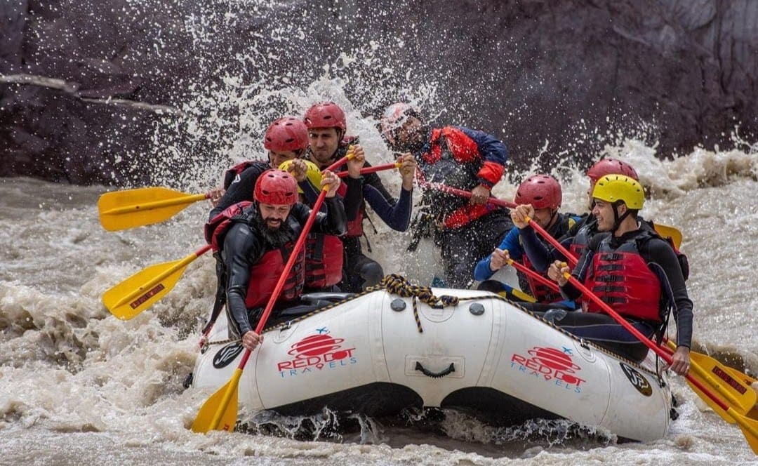 White water rafting through thrilling rapids on Maa Ganga river in Rishikesh